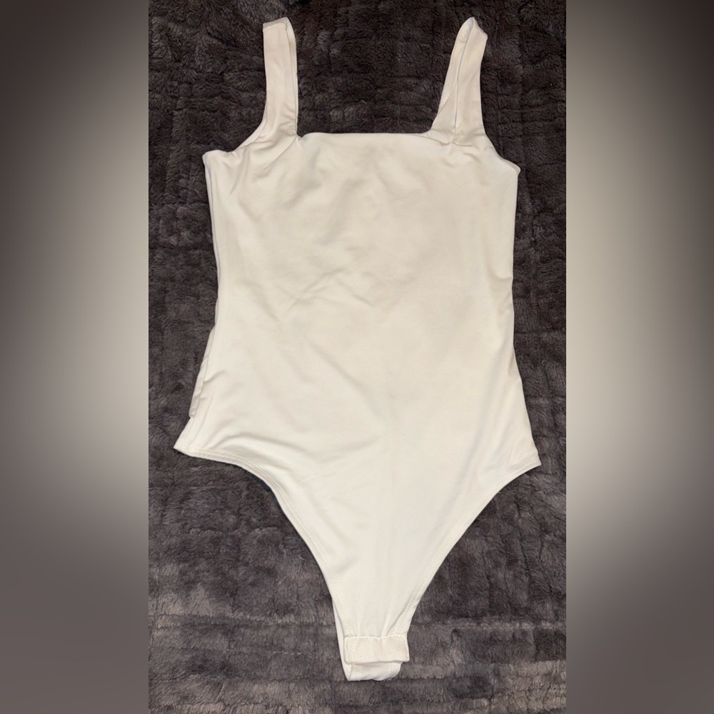 NWOT Woman’s White One Piece Double Lined Bodysuit